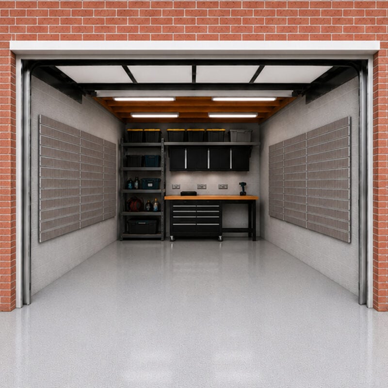 garage-storage-6-panel-kit - Uni-Shop Open storage room inside a brick building, with metal shelving, a wood workbench, and tools arranged on the shelves in a bright, clean space